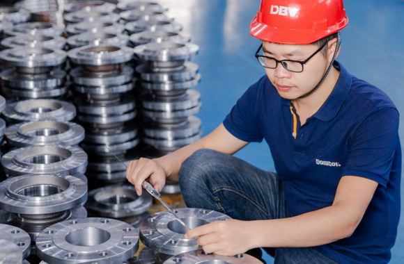 technician measuring the valve component