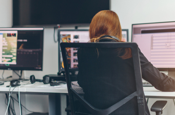 a blonde hair woman working on computer